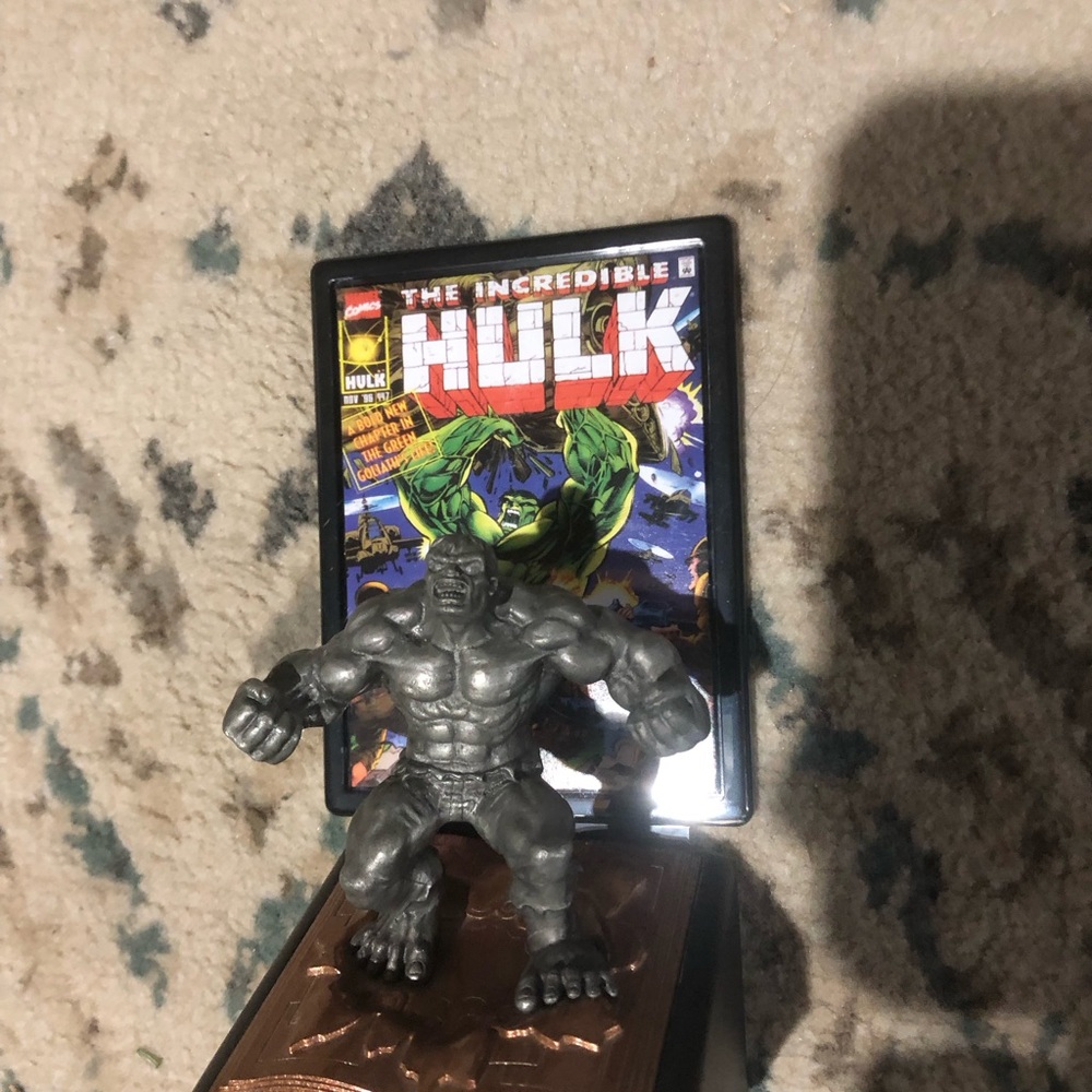 Gray Hulk Action Figure with Comic Background